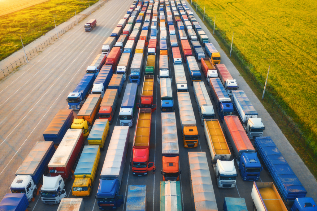 The AIS-140 (IRNSS) Regulation Mandated from April 1, 2019, and What It Means for Your Public Service/Commercial Vehicles 7 aerial view of colorful trucks in terminal at suns 2023 11 27 04 49 09 utc